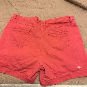 Pink shorts. They have one small spot on the back right side.